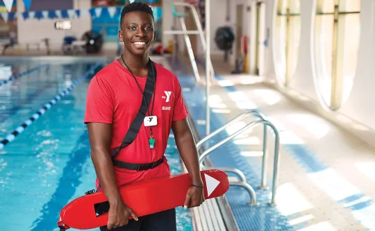 Lifeguard holding a rescue tube