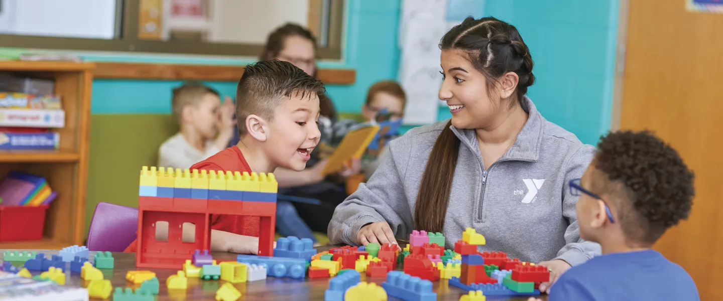 Youth playing blocks with teacher